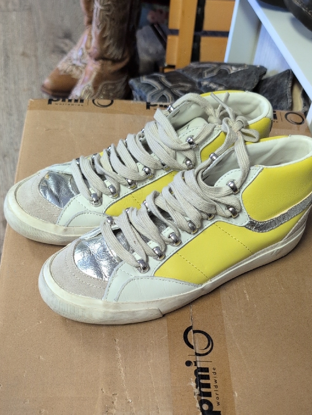 Marc Fisher LTD Merin 3 yellow and silver high-top sneakers.